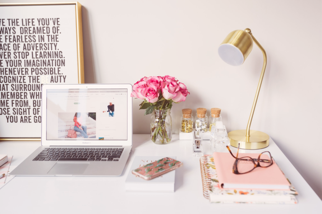 white desk with pink roses and gold lamp, working from home, tips for working from home, work from home