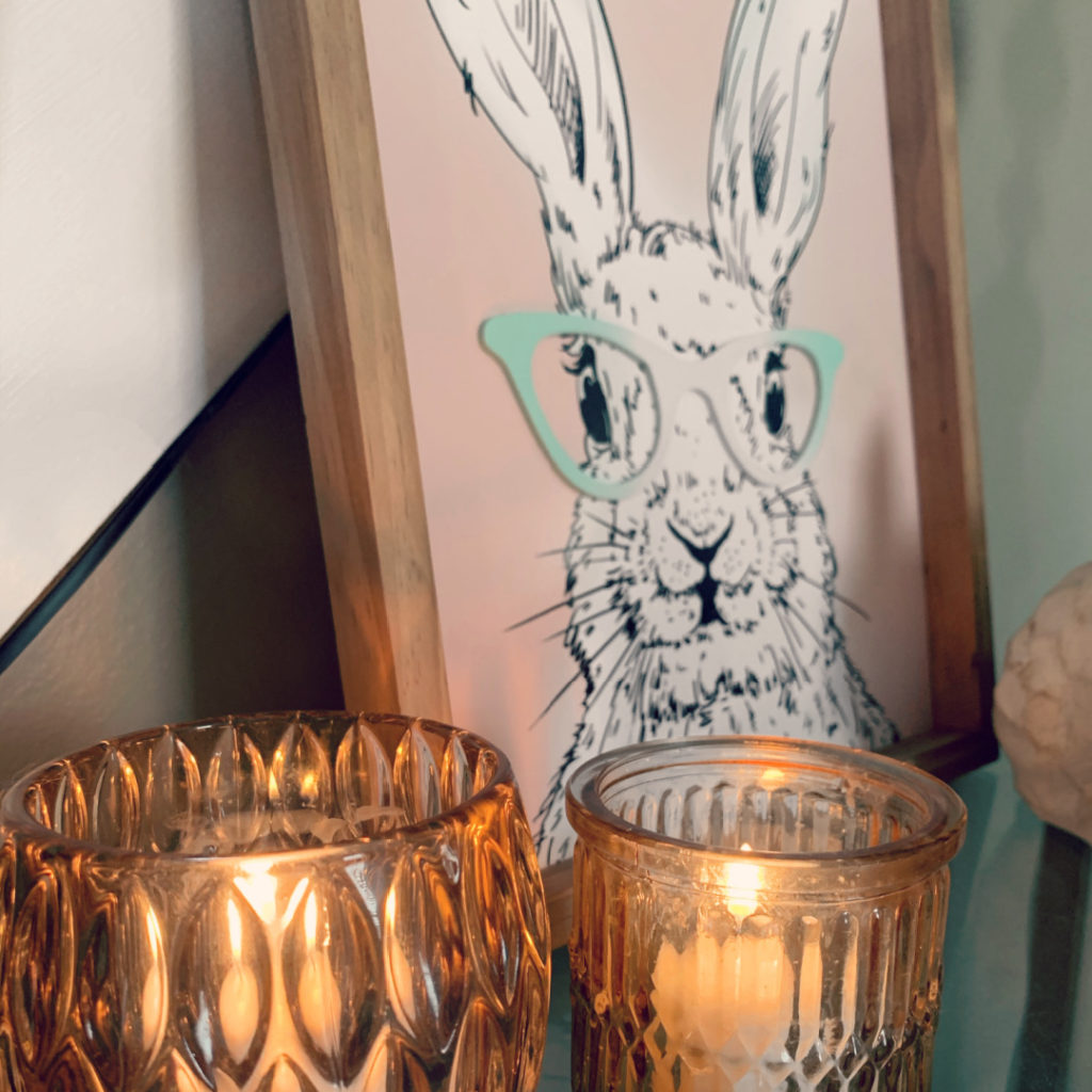 a decorative easter picture of a bunny rabbit wearing green glasses.