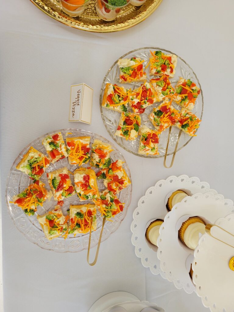 vegetable pizza slices on a platter at a cloud themed baby shower