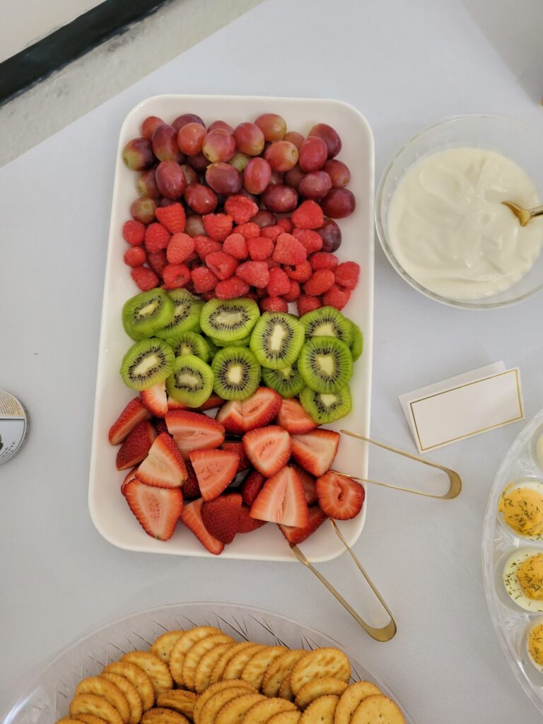 fruit spread on a food table at a cloud themed baby shower