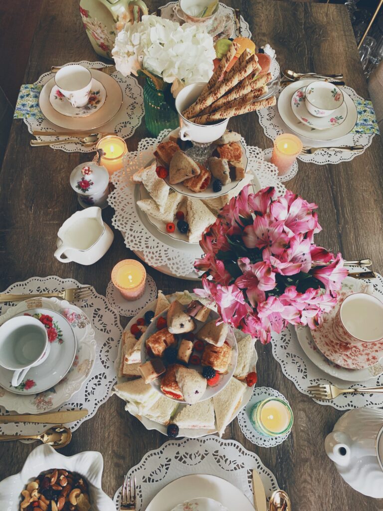 Mother's Day brunch table spread with an assortment of tea sandwiches and scones. 