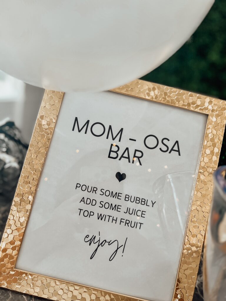 Mimosa bar signage for a bar at a cloud themed baby shower