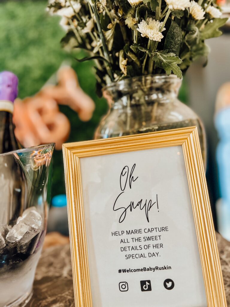 signage at a cloud themed baby shower