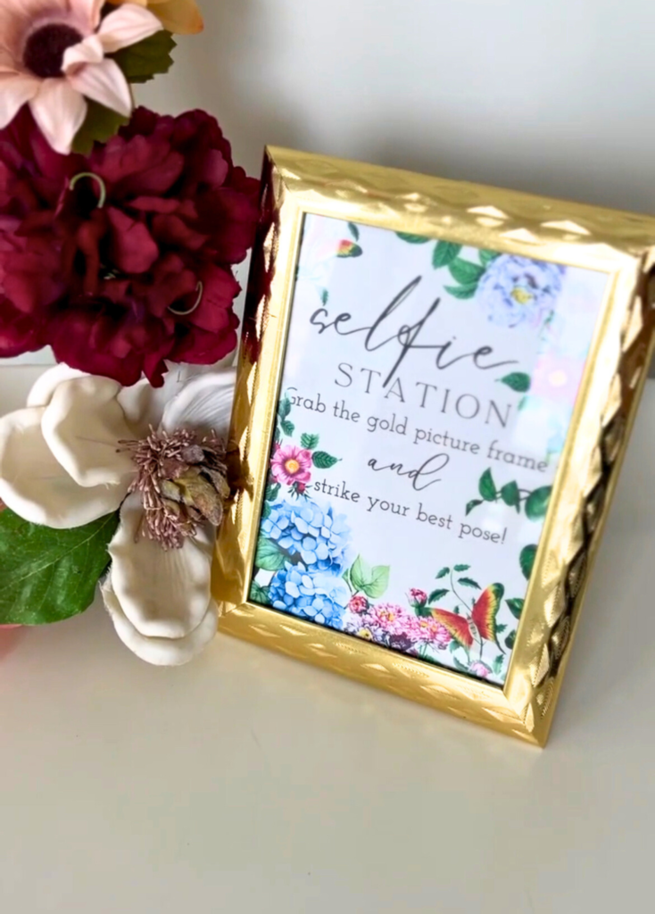 Gold framed sign at a garden themed birthday party