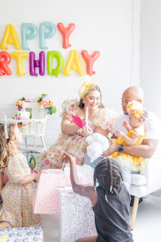 Opening gifts at our daughters garden party birthday