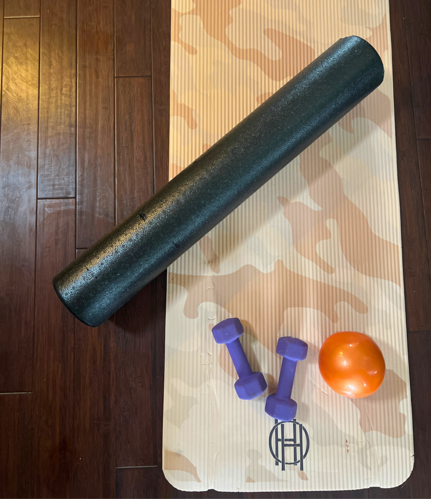 a yoga mat and weights for a blog post about simple habits to refresh your routine