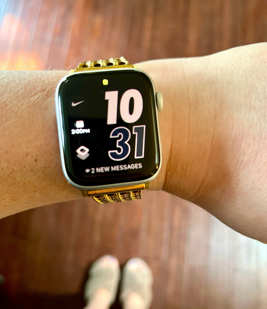 Picture of a smart watch on a wrist for a blog post about mom hacks