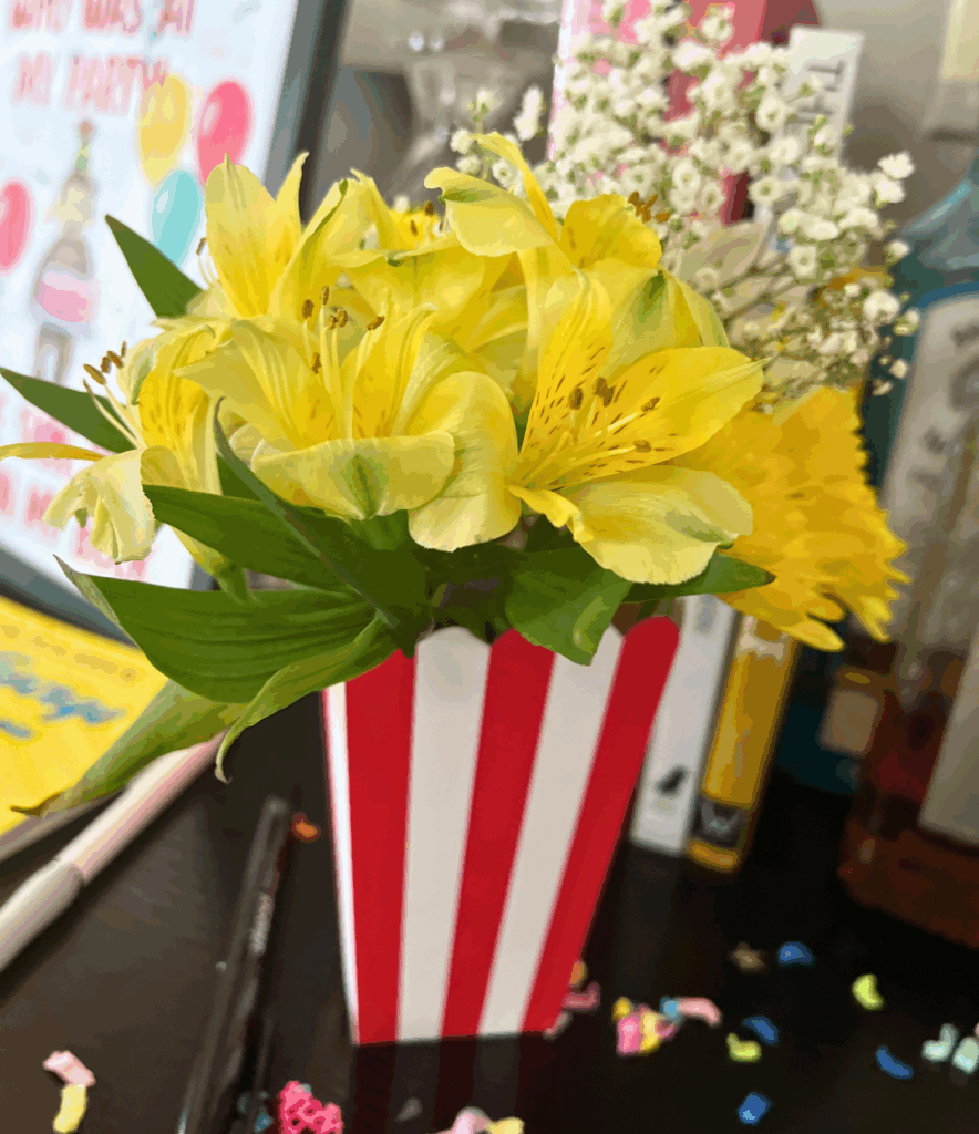 Popcorn bucket with yellow flowers for Curious George birthday party