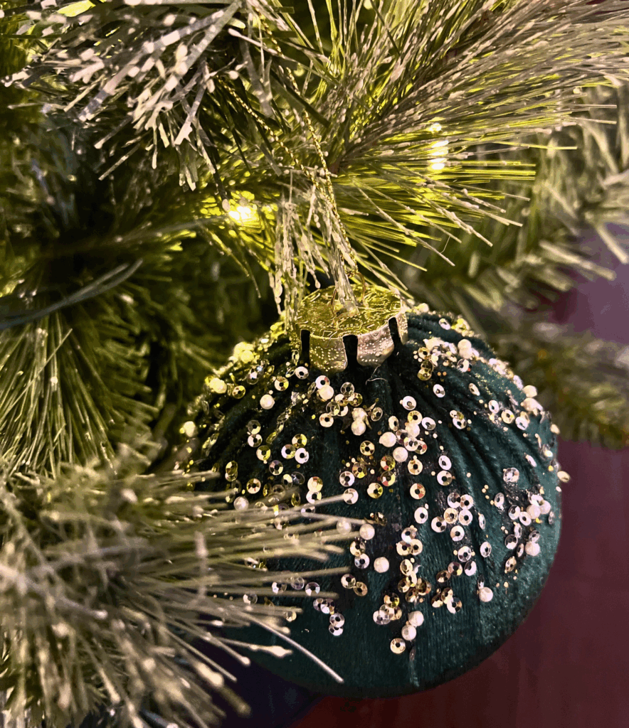 Green velvet christmas tree ornament for a blog post about the Ralph Lauren Christmas trend.