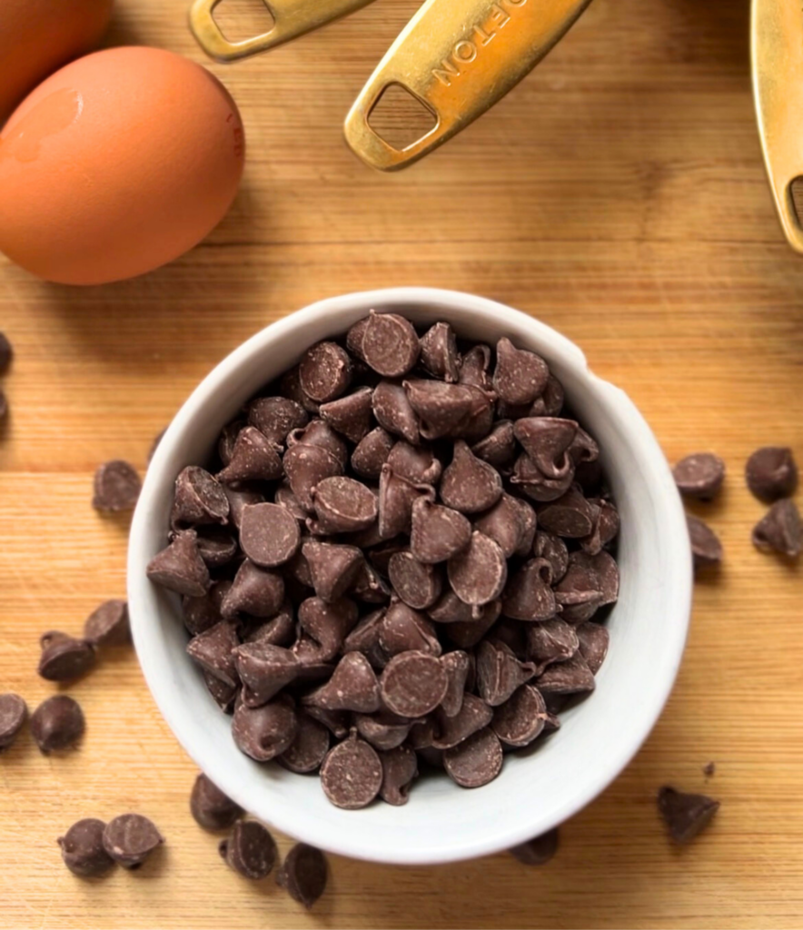Overhead shot of chocolate morsels for ingredients for a chocolate chip cookie cake