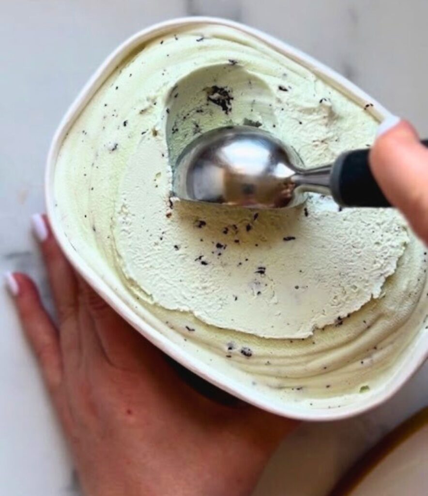 scooping mint ice cream for a copycat shamrock shake