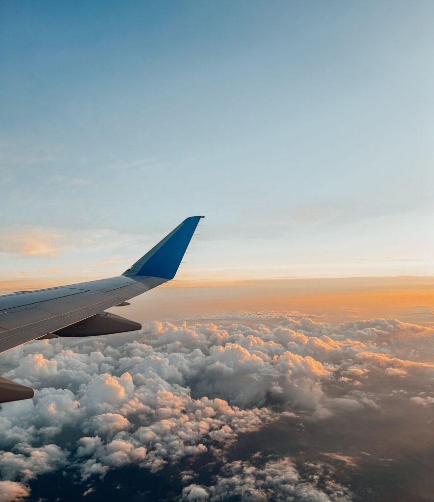 View from the plane window while traveling alone, solo travel for women moment
