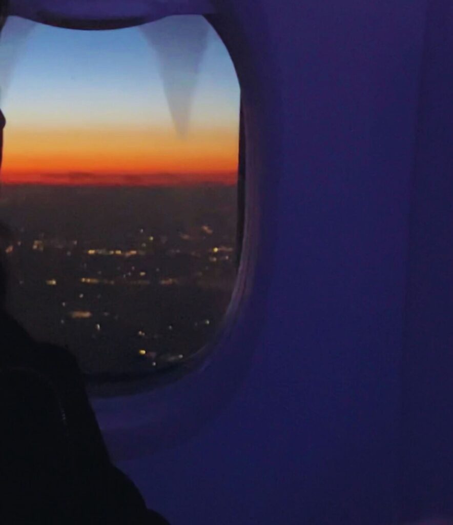 Airplane window view during a solo trip, solo travel for women journey