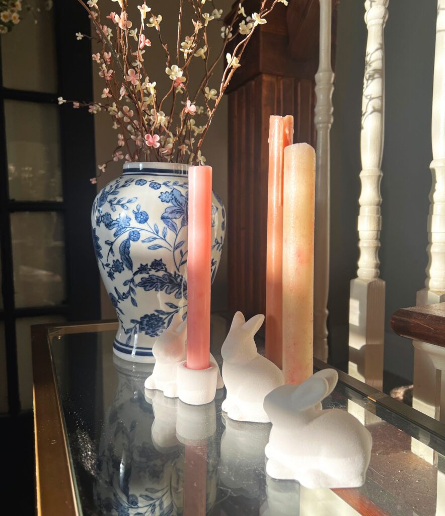 simple spring decor in an entryway with soft neutral tones and light seasonal accents