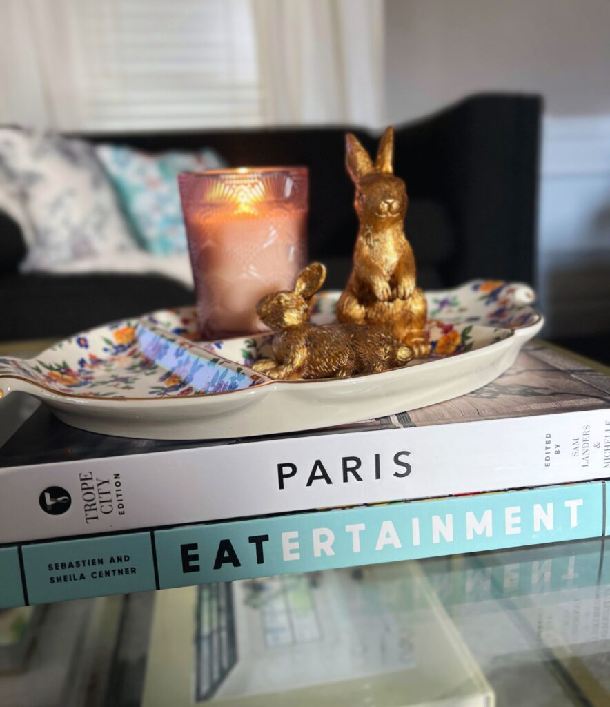 simple spring decor styled on a coffee table with delicate budding florals and soft tones