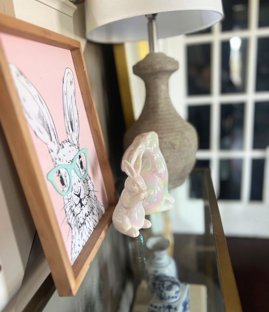simple spring decor in an entry way with white bunny accents and neutral textures